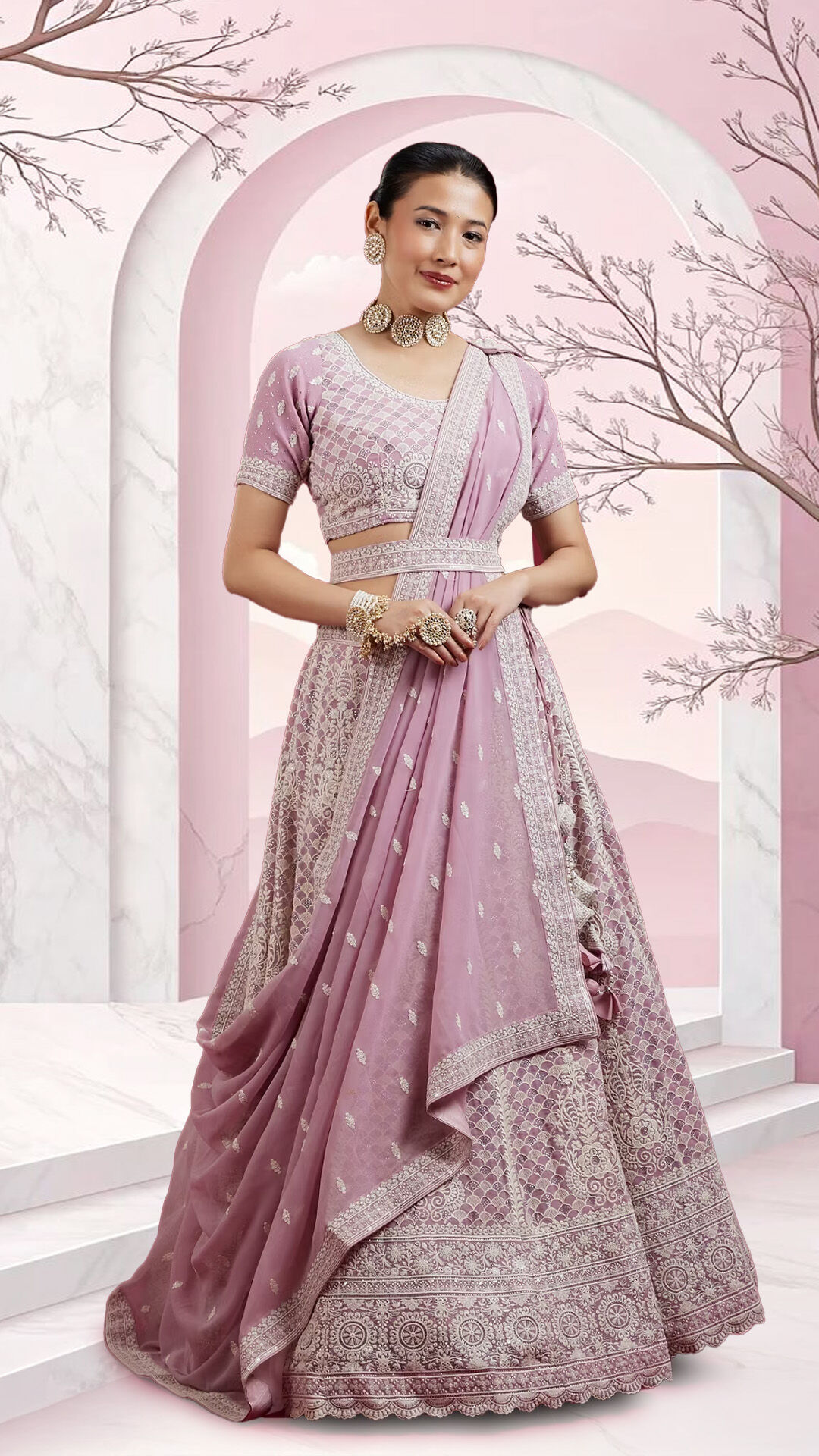A stylish woman modeling a pale purple lehenga with a heavy skirt and embroidered blouse